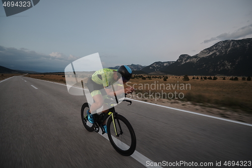 Image of triathlon athlete riding bike