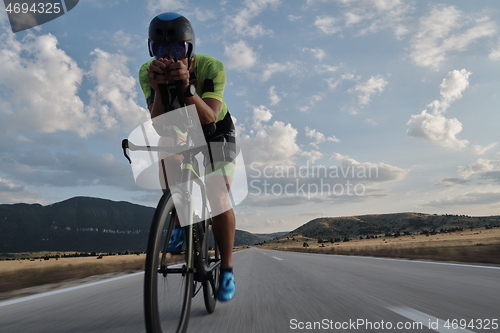 Image of triathlon athlete riding bike