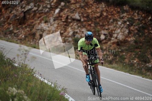 Image of triathlon athlete riding bike