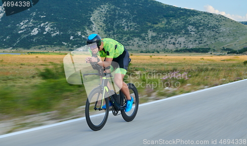 Image of triathlon athlete riding bike