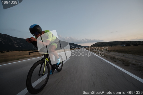 Image of triathlon athlete riding bike