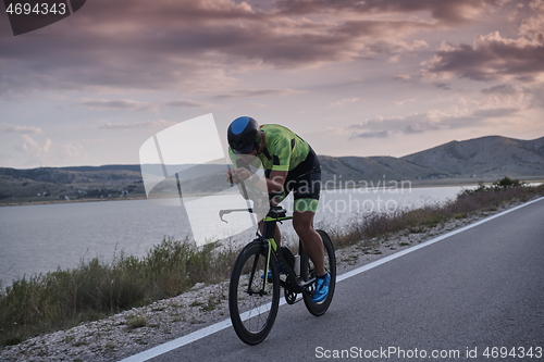 Image of triathlon athlete riding bike