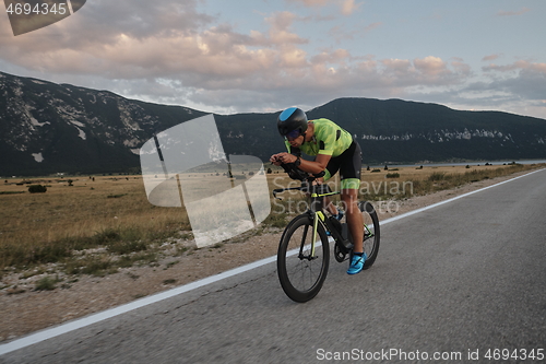 Image of triathlon athlete riding bike