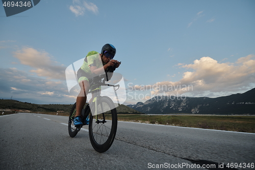 Image of triathlon athlete riding bike