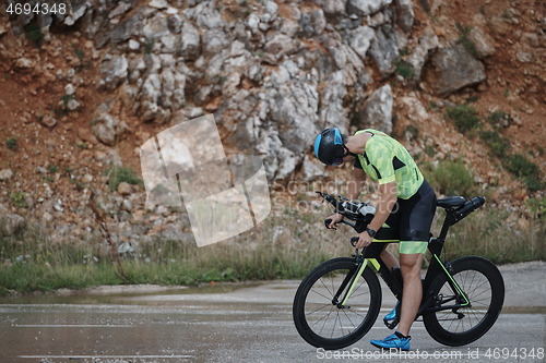 Image of triathlon athlete riding bike