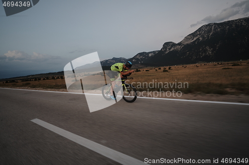 Image of triathlon athlete riding bike