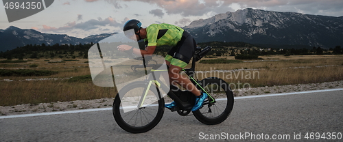 Image of triathlon athlete riding bike