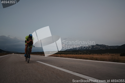 Image of triathlon athlete riding bike