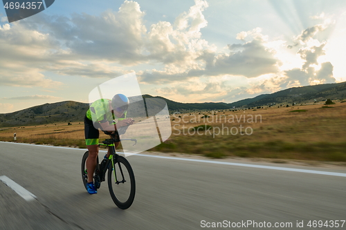 Image of triathlon athlete riding bike