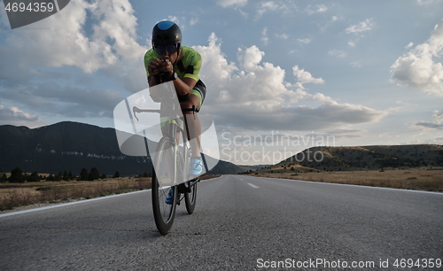 Image of triathlon athlete riding bike