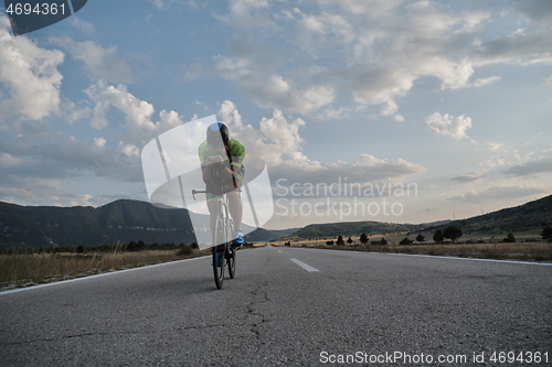 Image of triathlon athlete riding bike