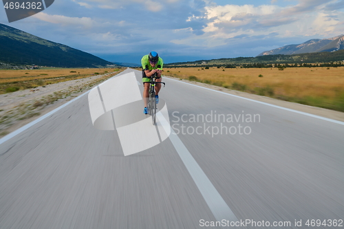 Image of triathlon athlete riding bike