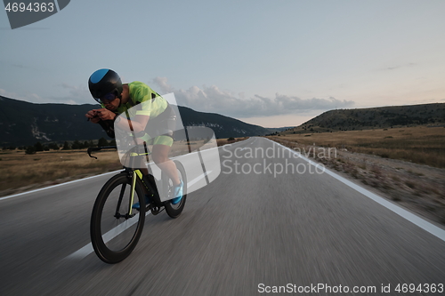 Image of triathlon athlete riding bike