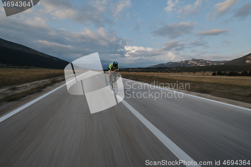 Image of triathlon athlete riding bike