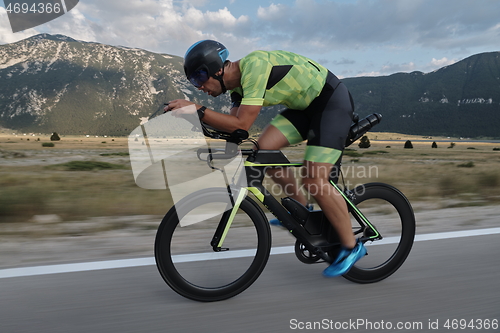 Image of triathlon athlete riding bike