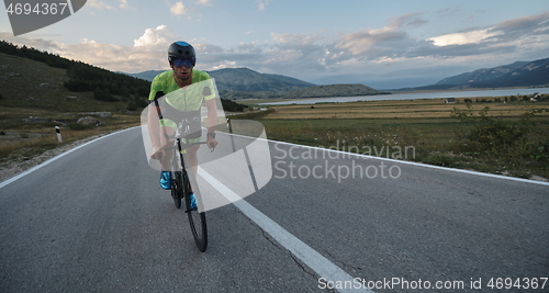 Image of triathlon athlete riding bike