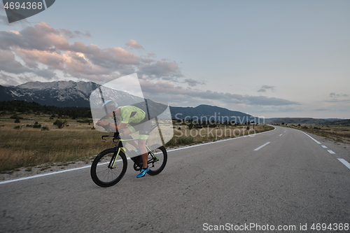 Image of triathlon athlete riding bike