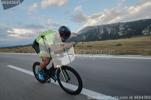 Image of triathlon athlete riding bike