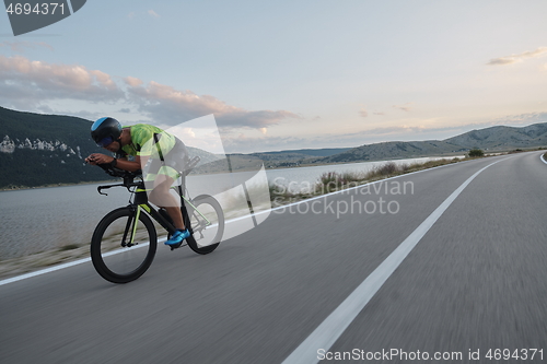 Image of triathlon athlete riding bike