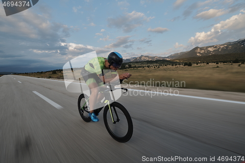 Image of triathlon athlete riding bike