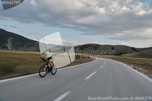 Image of triathlon athlete riding bike