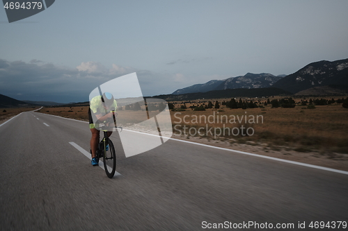 Image of triathlon athlete riding bike