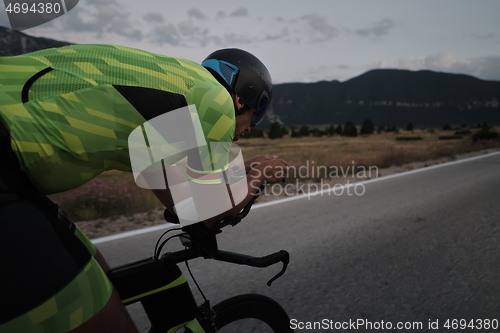 Image of triathlon athlete riding bike