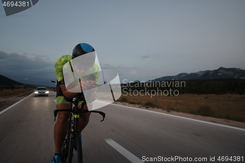 Image of triathlon athlete riding bike