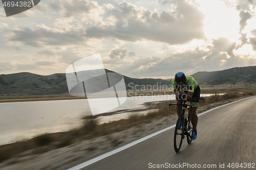 Image of triathlon athlete riding bike