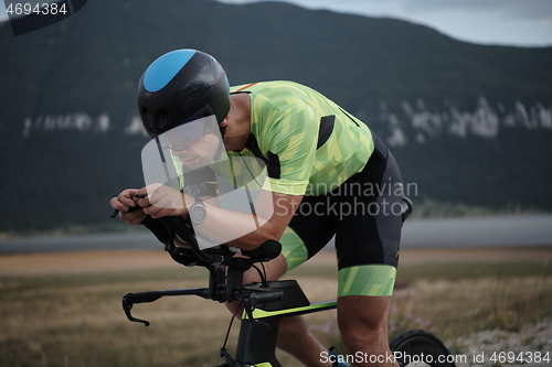 Image of triathlon athlete riding bike