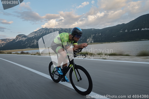 Image of triathlon athlete riding bike