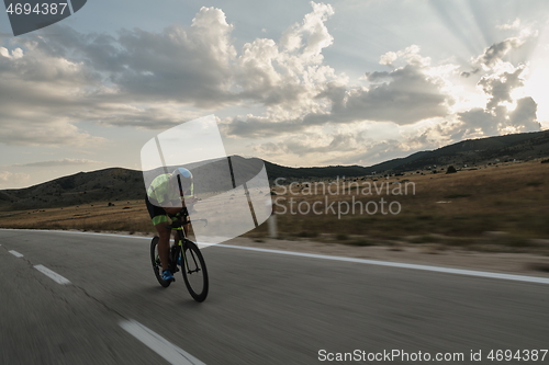 Image of triathlon athlete riding bike