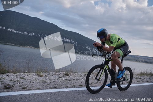 Image of triathlon athlete riding bike