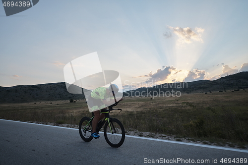 Image of triathlon athlete riding bike