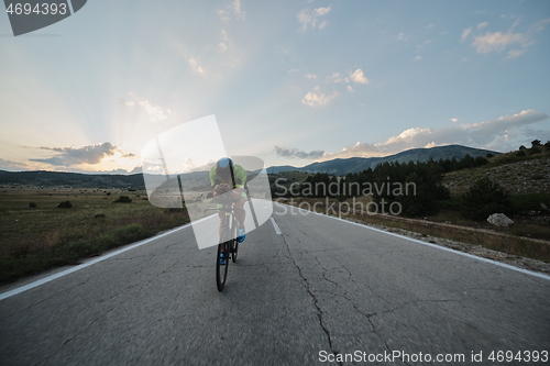 Image of triathlon athlete riding bike