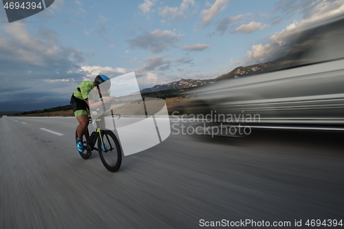 Image of triathlon athlete riding bike