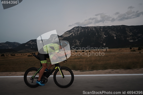 Image of triathlon athlete riding bike