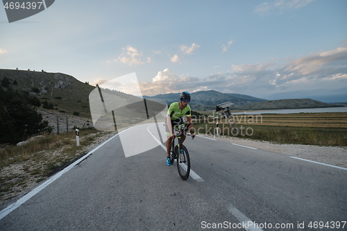 Image of triathlon athlete riding bike