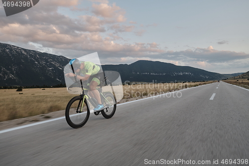 Image of triathlon athlete riding bike