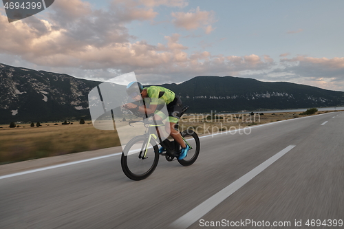 Image of triathlon athlete riding bike