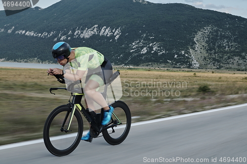 Image of triathlon athlete riding bike