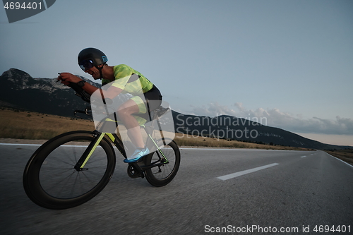 Image of triathlon athlete riding bike