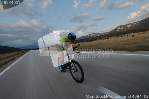 Image of triathlon athlete riding bike