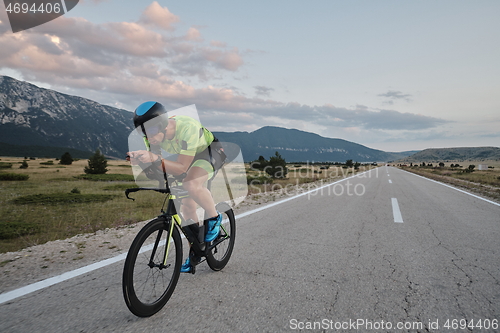 Image of triathlon athlete riding bike