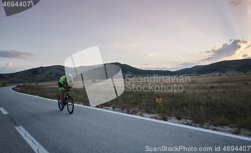 Image of triathlon athlete riding bike