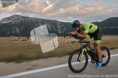 Image of triathlon athlete riding bike