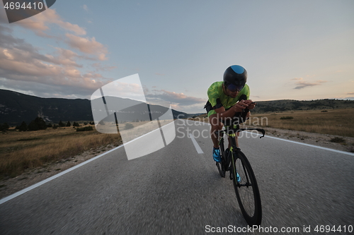 Image of triathlon athlete riding bike