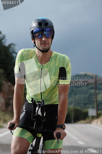 Image of triathlon athlete riding bike