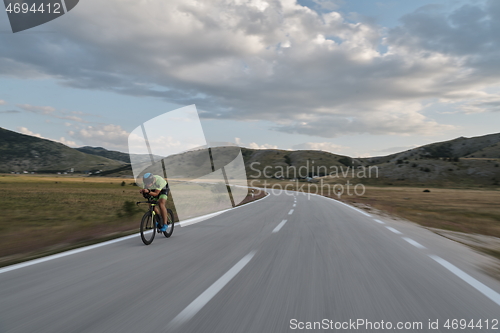 Image of triathlon athlete riding bike