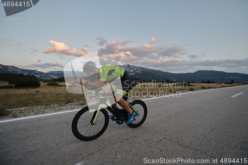 Image of triathlon athlete riding bike